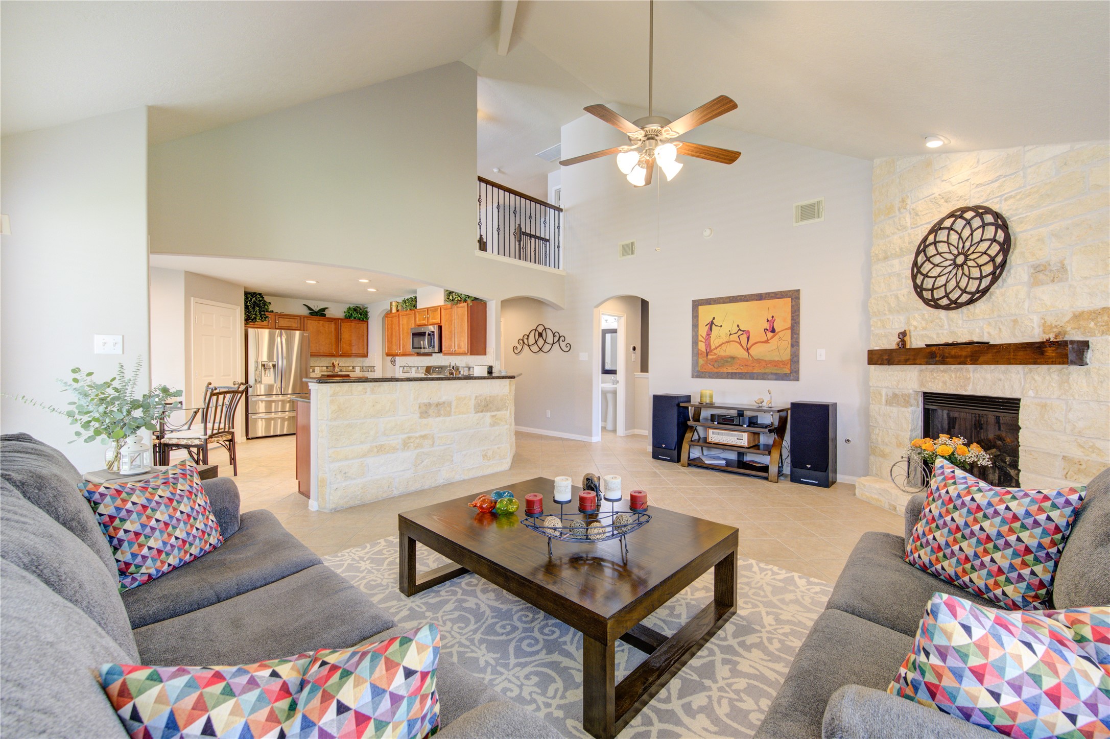 25215 Hazel Ranch Drive Katy, TX 77494 - Photo 17 of 32 a living room with furniture a fireplace and a flat screen tv