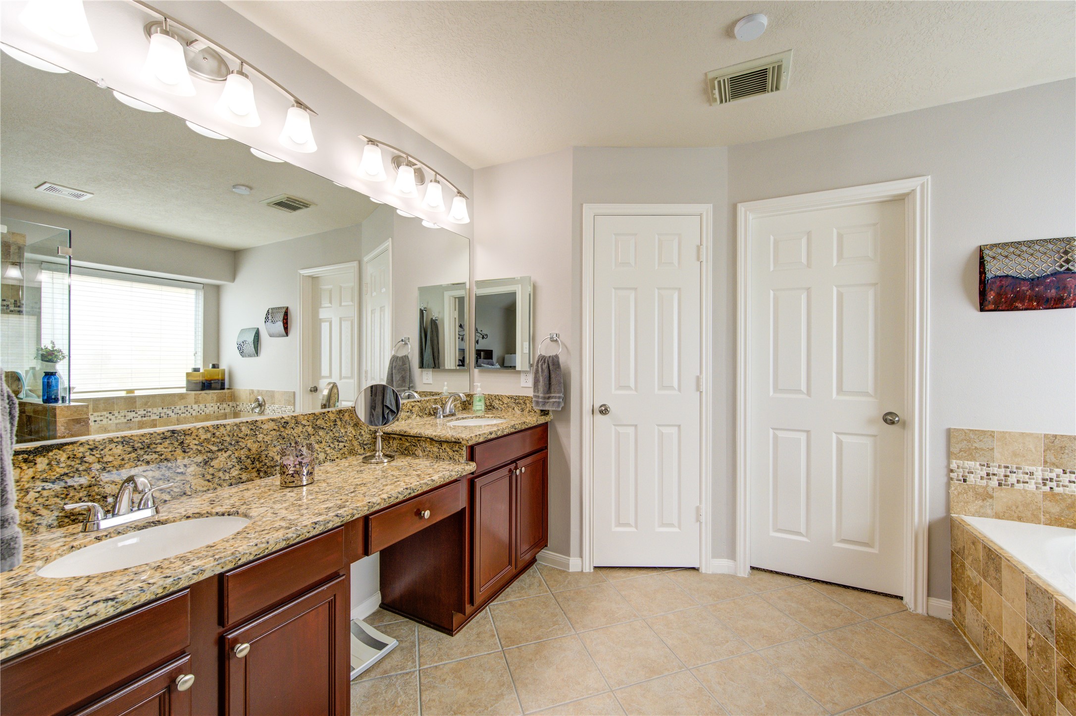 25215 Hazel Ranch Drive Katy, TX 77494 - Photo 19 of 32 a bathroom with a granite countertop sink and a mirror