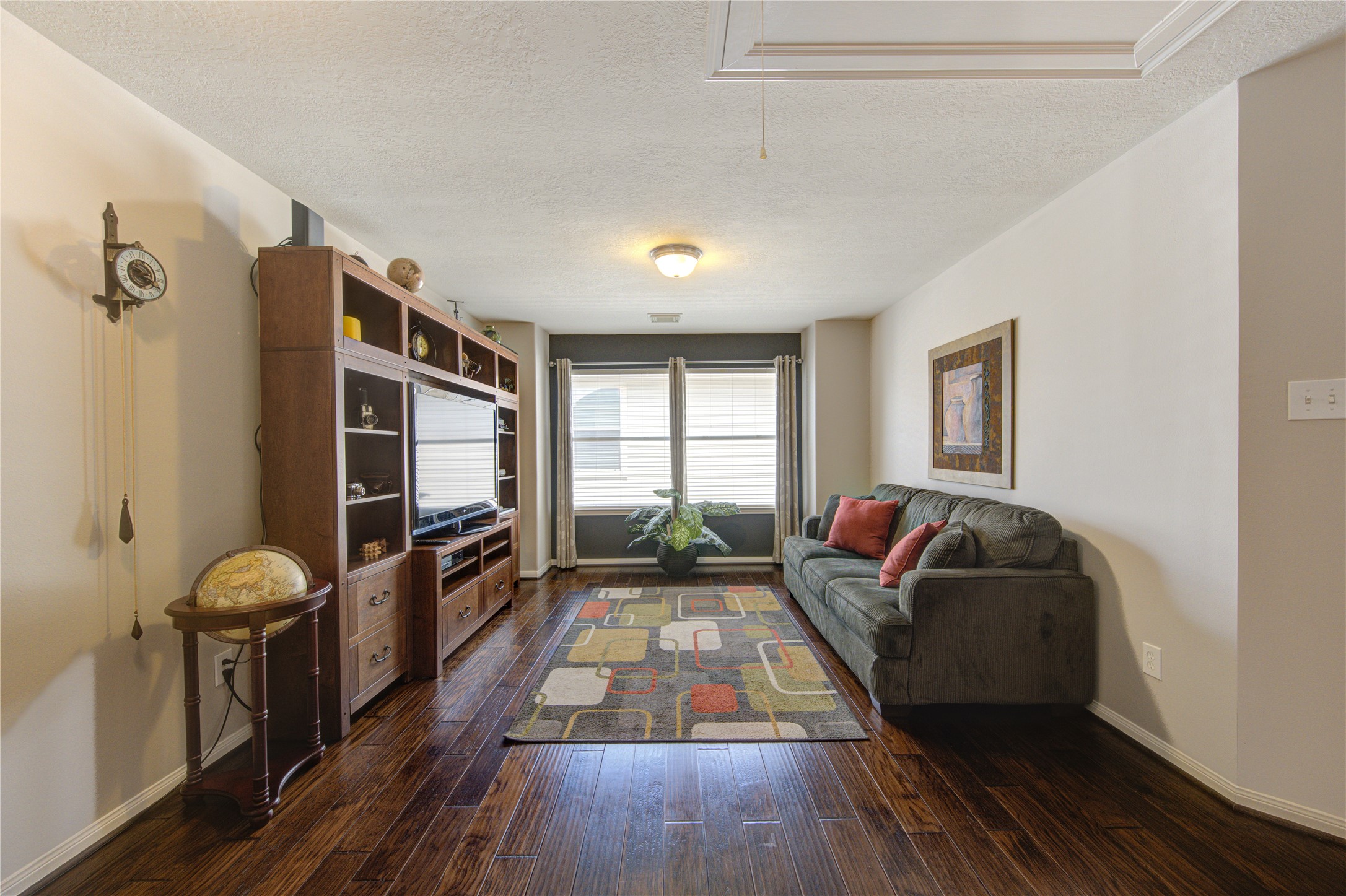 25215 Hazel Ranch Drive Katy, TX 77494 - Photo 27 of 32 a living room with furniture and a flat screen tv