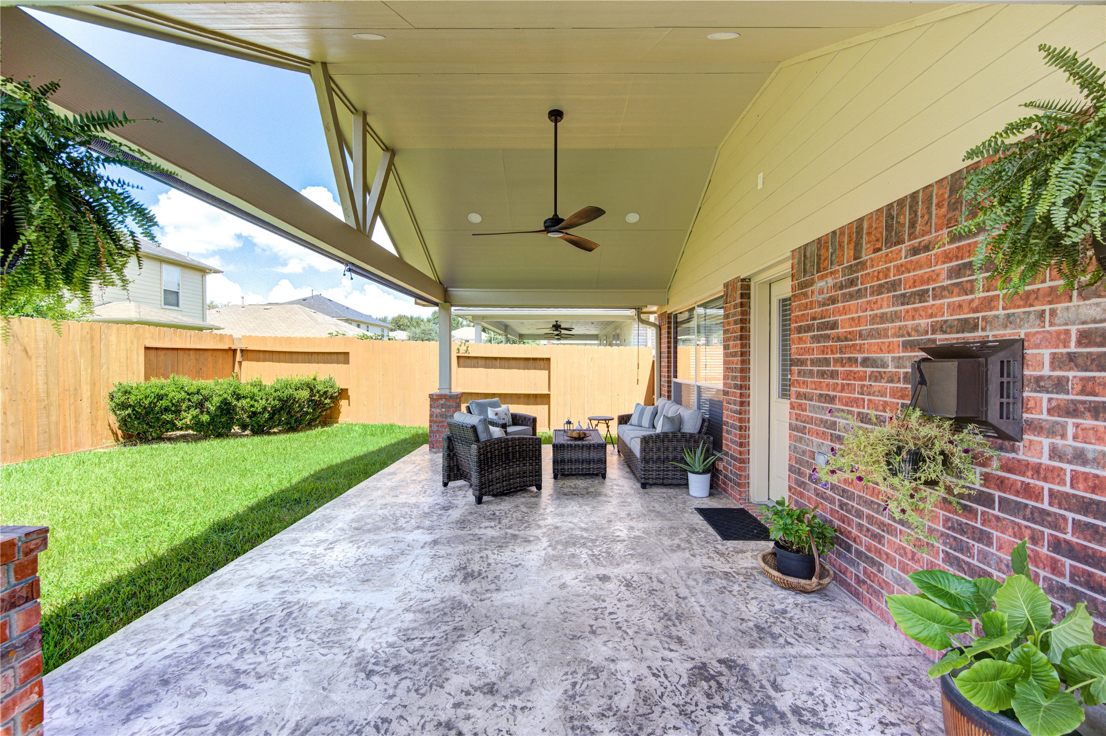 25215 Hazel Ranch Drive Katy, TX 77494 - Photo 30 of 32 a view of a porch with chairs and potted plants