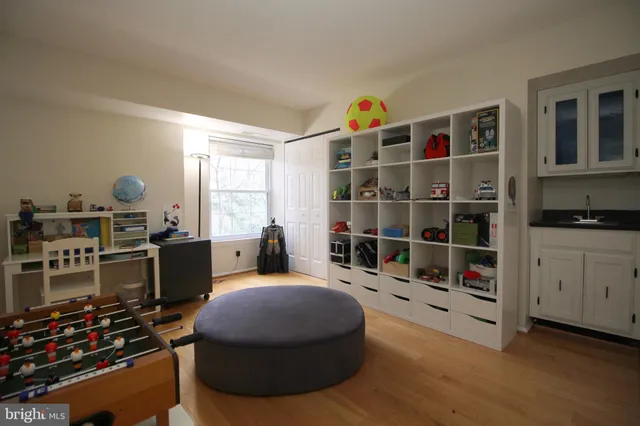 a room with furniture a rug and gym equipment