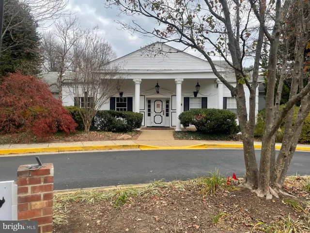 a view of a house with pool and a garden