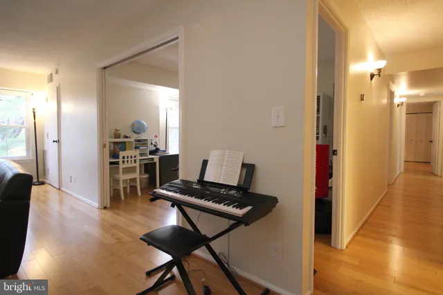 a view of kitchen and dining room with wooden floor