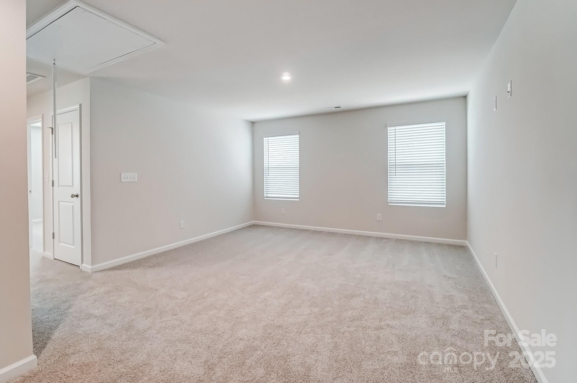 1471 Honey Trail Monroe, NC 28112 - Photo 16 of 27 an empty room with windows