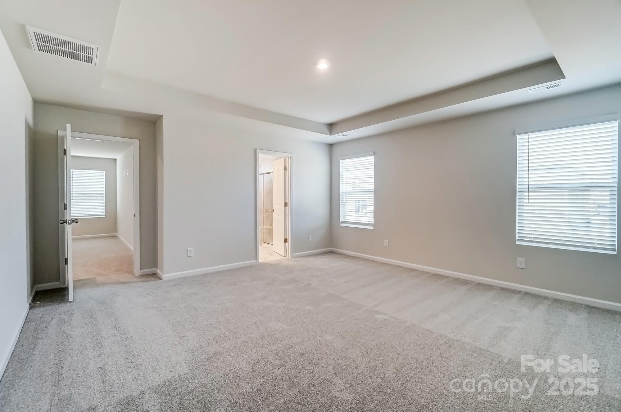 1471 Honey Trail Monroe, NC 28112 - Photo 20 of 27 an empty room with windows and closet