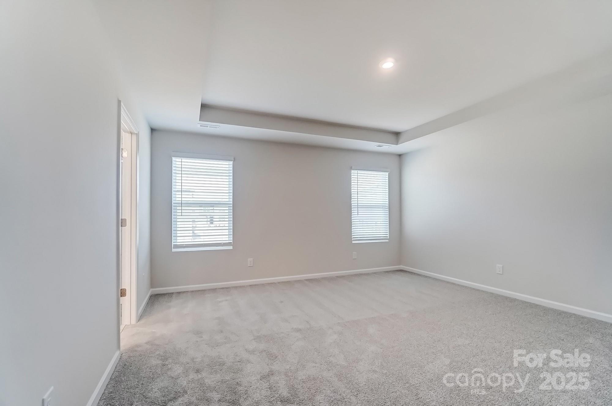 1471 Honey Trail Monroe, NC 28112 - Photo 21 of 27 an empty room with windows