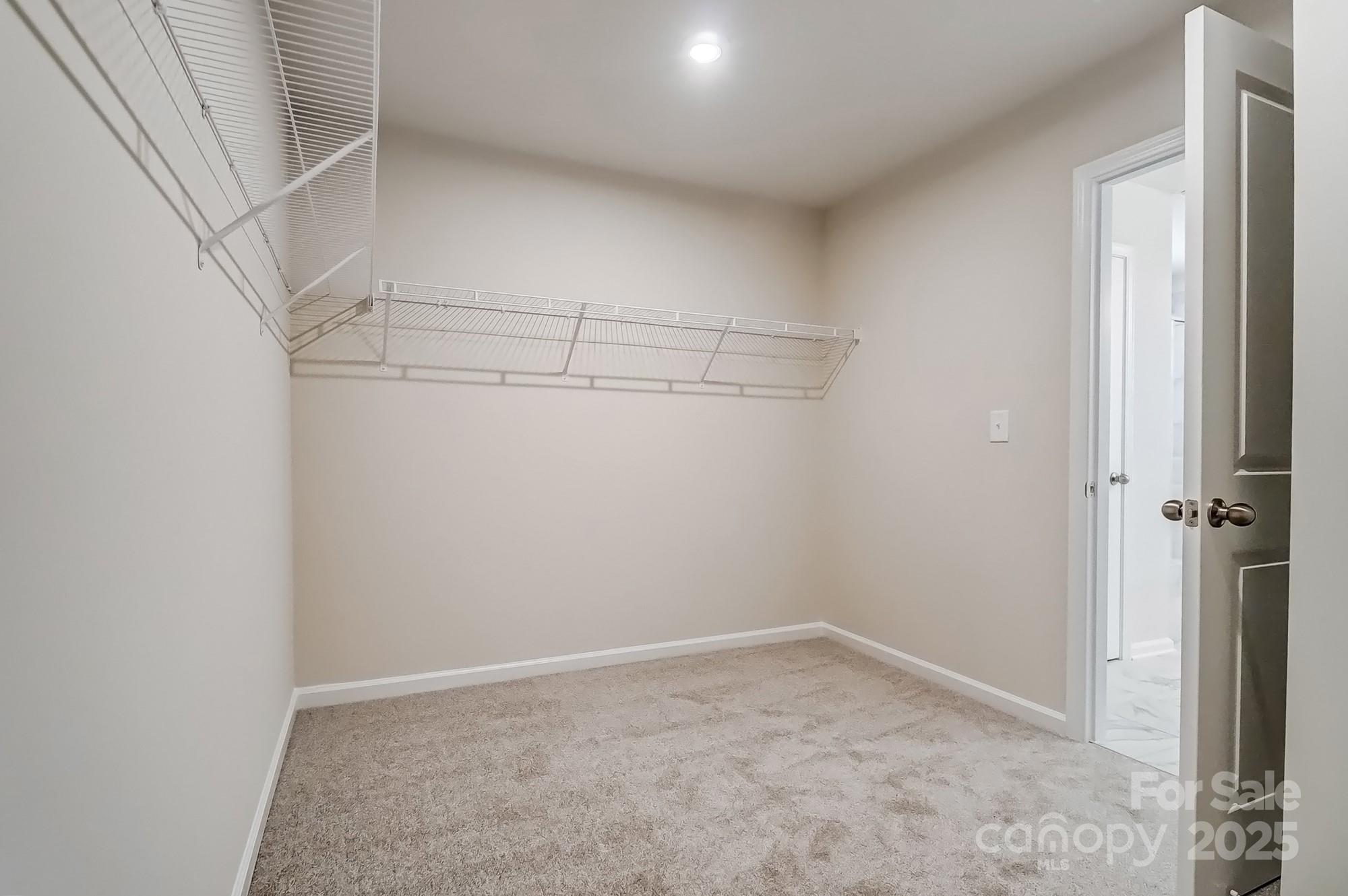 1471 Honey Trail Monroe, NC 28112 - Photo 22 of 27 a view of a room with racks on the wall