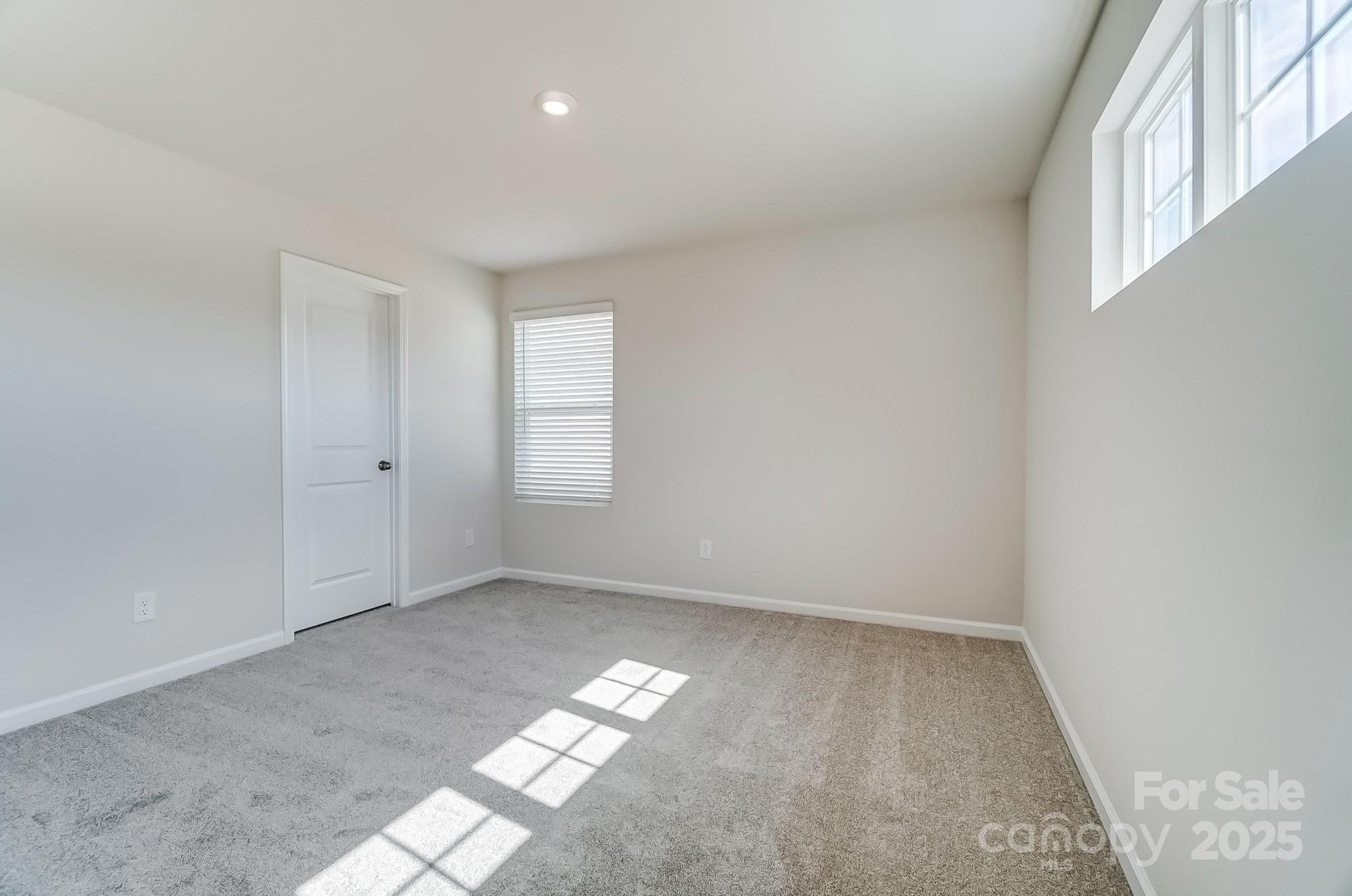 1471 Honey Trail Monroe, NC 28112 - Photo 25 of 27 an empty room with windows
