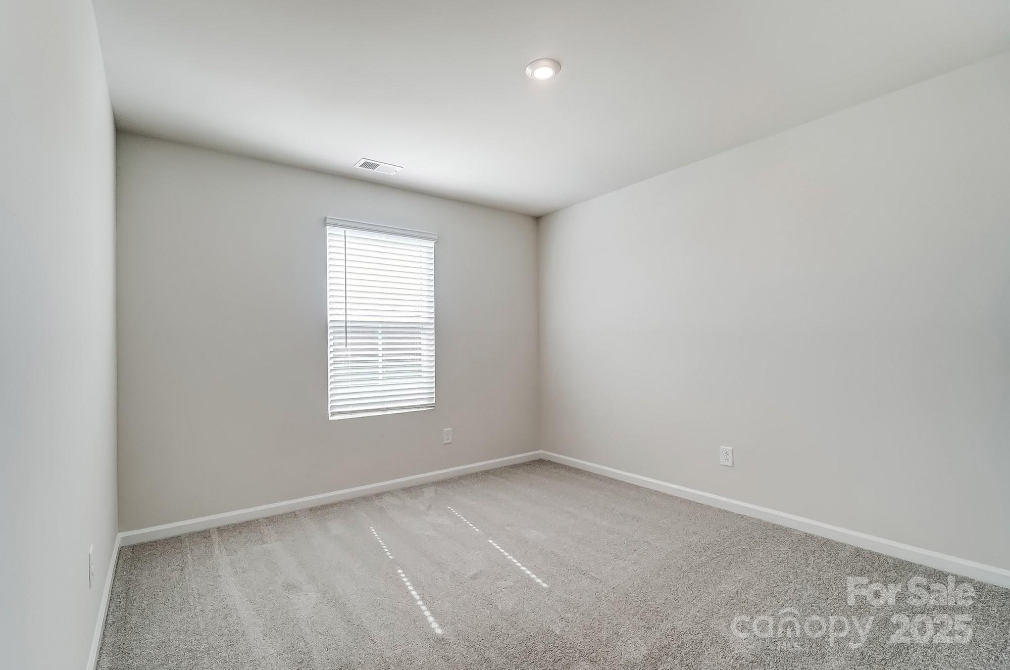 1471 Honey Trail Monroe, NC 28112 - Photo 4 of 27 an empty room with a window