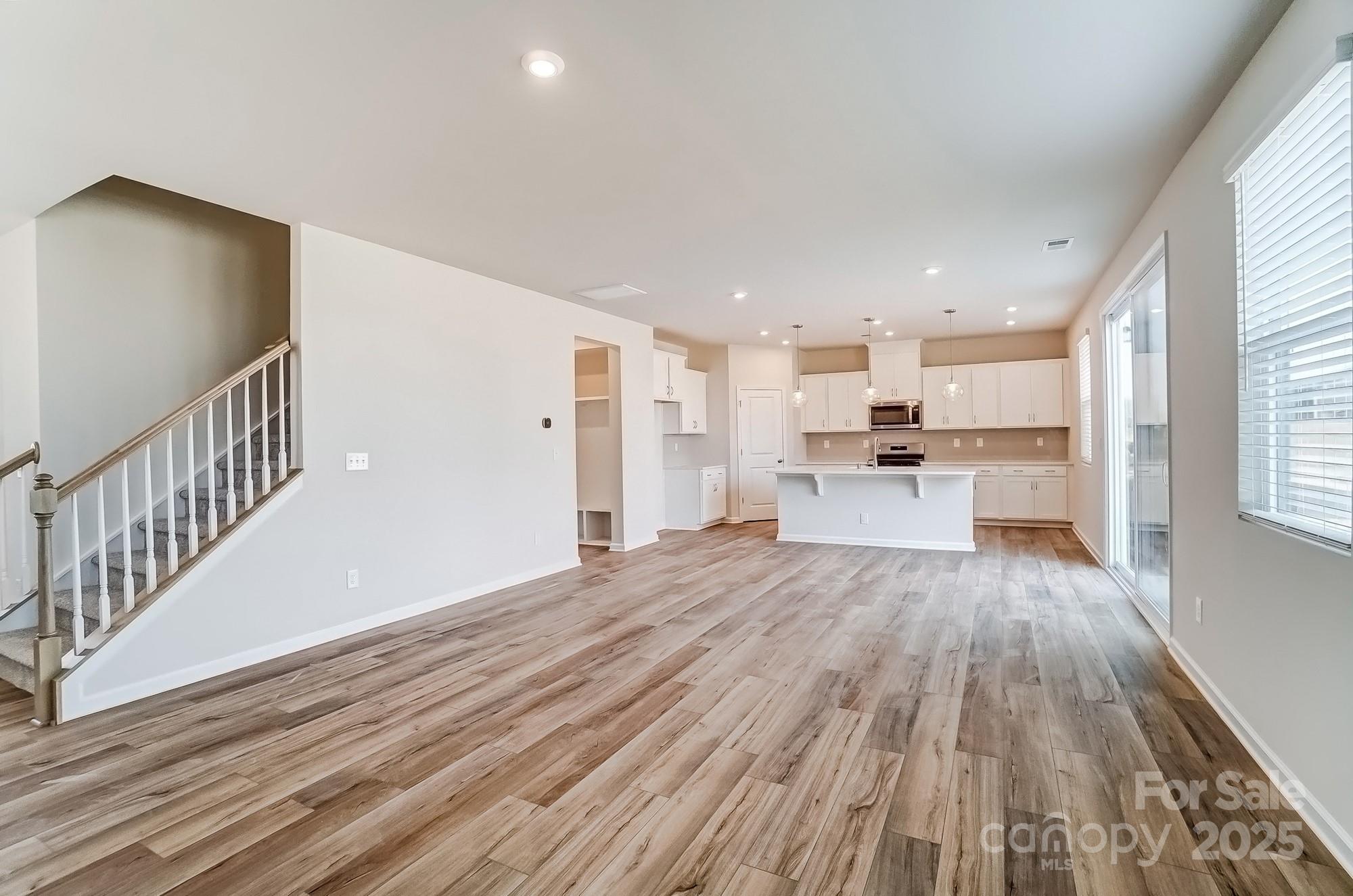 1471 Honey Trail Monroe, NC 28112 - Photo 7 of 27 a view of kitchen with wooden floor
