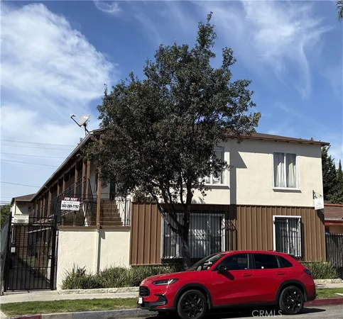 a view of cars parked in front of a building