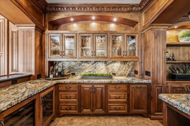 a kitchen with stainless steel appliances granite countertop a sink and a stove