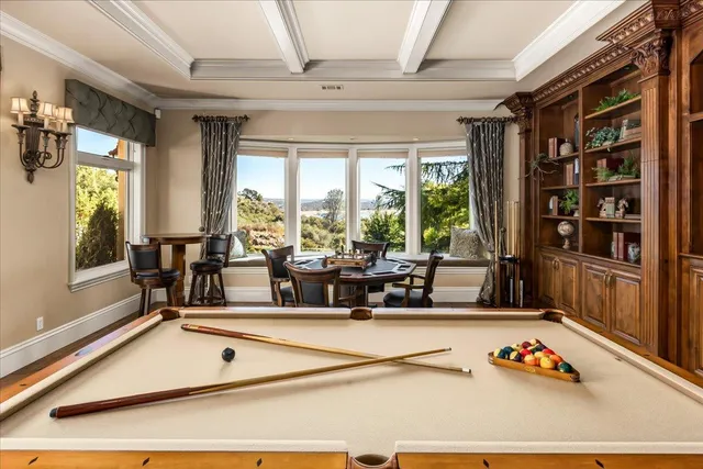 a view of a kitchen with a sink and cabinets
