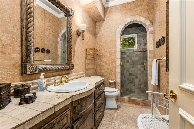 a wooden bench sitting in front of a house