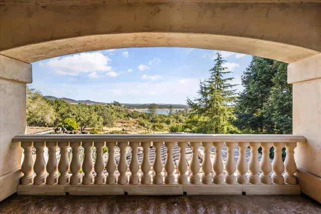 a view of a living room with furniture and a fireplace
