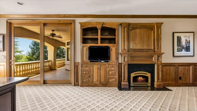 a view of a house with a big yard and large trees