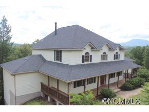 344 Christopher Road Tryon, NC 28782 - Photo 1 of 24 a aerial view of a house with a yard and plants