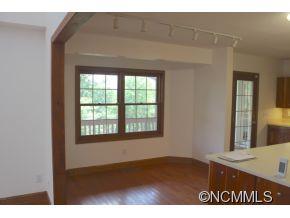 344 Christopher Road Tryon, NC 28782 - Photo 12 of 24 a view of an empty room with wooden floor and a window