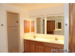 344 Christopher Road Tryon, NC 28782 - Photo 4 of 24 a bathroom with a sink and a mirror