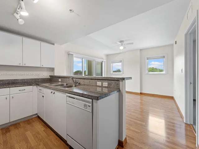 a kitchen with a sink and cabinets