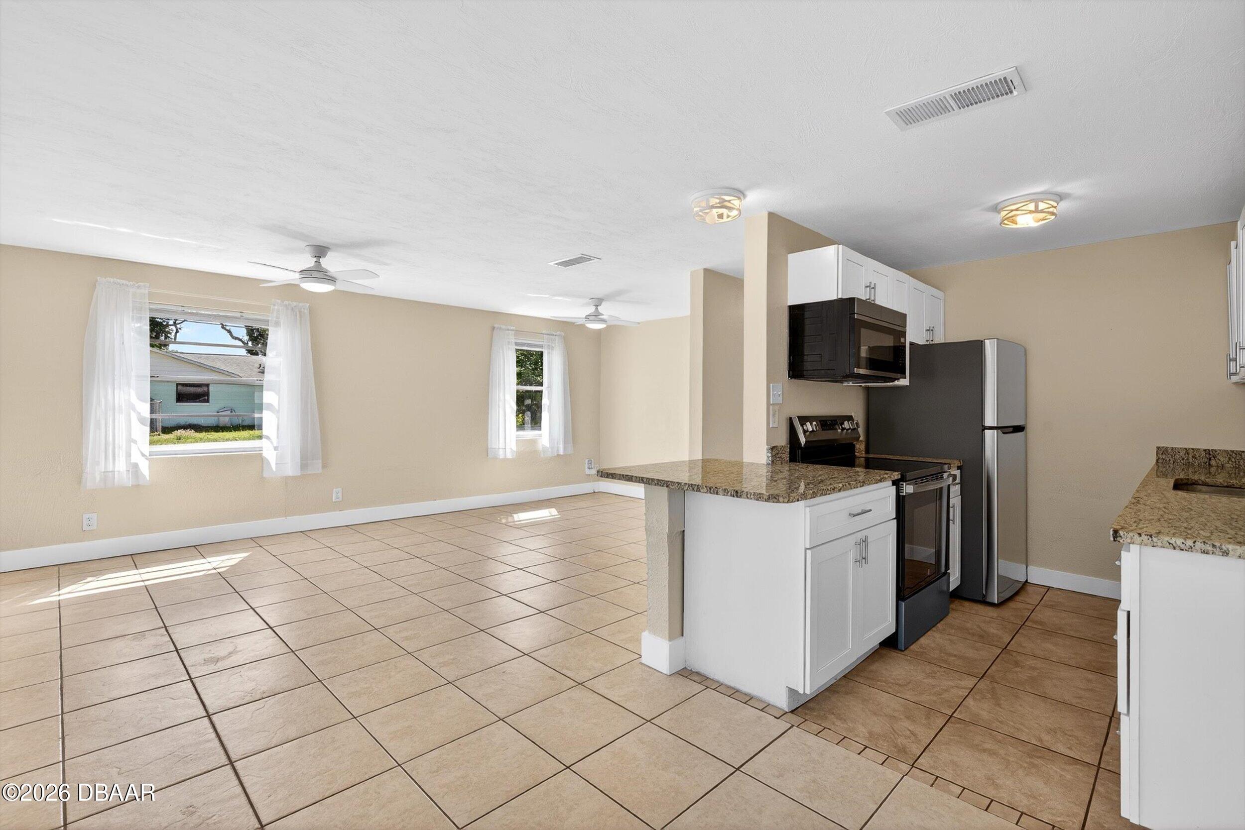 128 Oak Ridge Avenue Edgewater, FL 32132 - Photo 16 of 65 kitchen, lvgroom