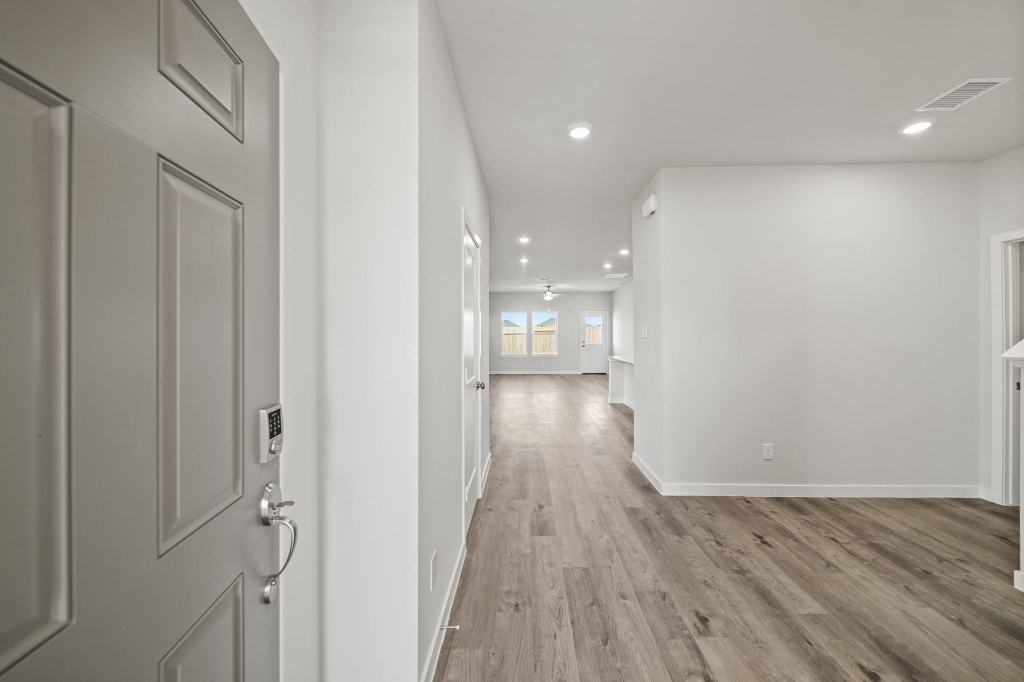 314 Bennett Street Angleton, TX 77515 - Photo 3 of 27 a view of a hallway with wooden floor