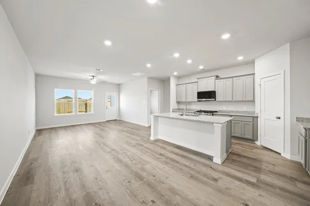 a view of kitchen with granite countertop cabinets and steel stainless steel appliances