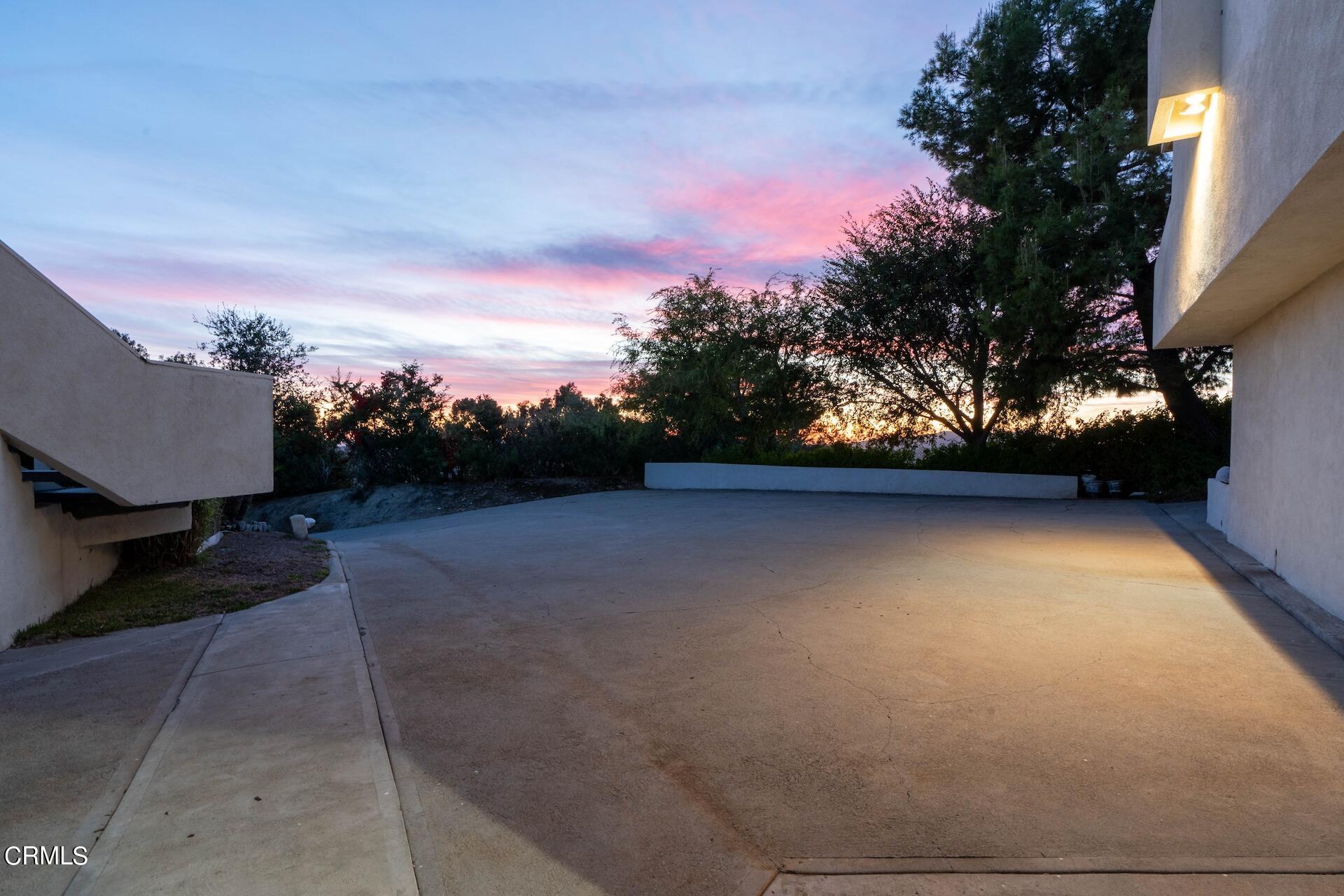83 Patrician Way Pasadena, CA 91105 - Photo 35 of 36 driveway at sunset