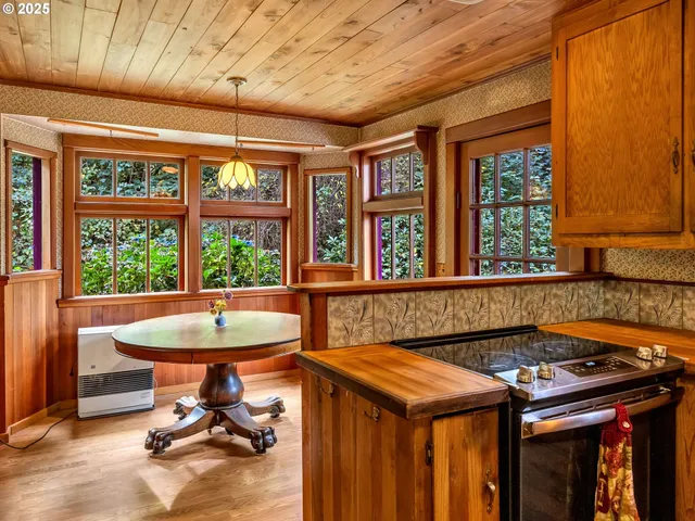 a kitchen with a stove a sink and a refrigerator