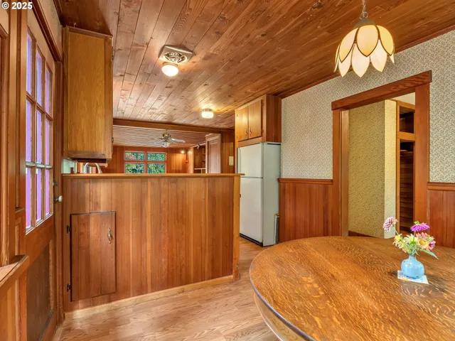 a view of a bedroom with furniture and chandelier