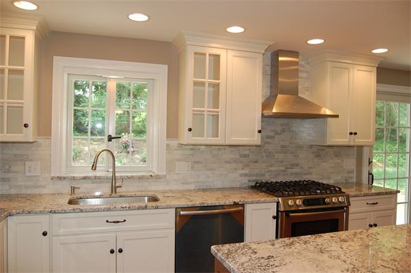 17 Willowdale Road Winchester, MA 01890 - Photo 11 of 24 a kitchen with a sink stove and cabinets
