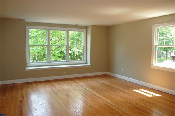 17 Willowdale Road Winchester, MA 01890 - Photo 21 of 24 a view of an empty room with wooden floor and a window