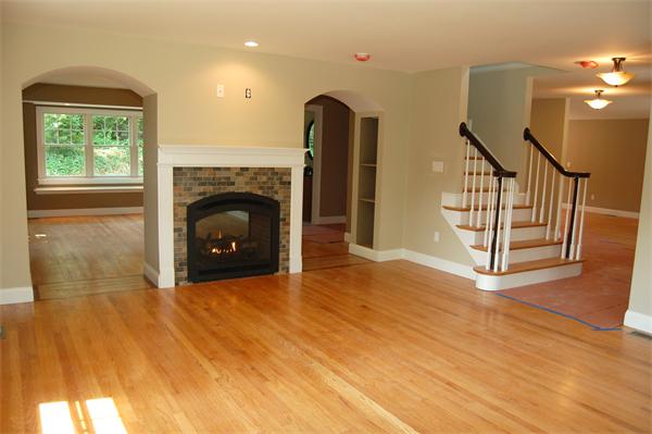17 Willowdale Road Winchester, MA 01890 - Photo 5 of 24 a view of empty room with fireplace and wooden floor
