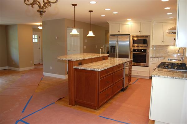 17 Willowdale Road Winchester, MA 01890 - Photo 8 of 24 a kitchen with kitchen island a counter top space appliances and a ceiling fan