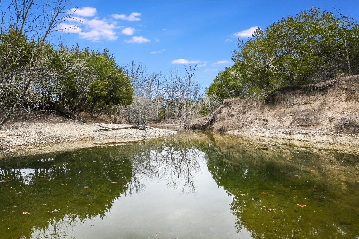 5150 Cr 254 Bertram Tx 78605 Bertram, TX 78605 - Photo 1 of 40 a view of a lake from a yard