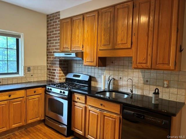 1444 Boston Post Road, Unit 3G Larchmont, NY 10538 - Photo 6 of 18 a kitchen with granite countertop cabinets stainless steel appliances a sink and window