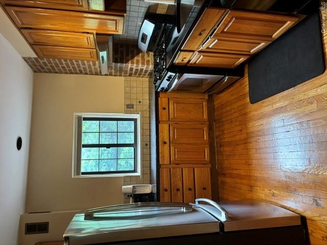 1444 Boston Post Road, Unit 3G Larchmont, NY 10538 - Photo 7 of 18 a kitchen with stainless steel appliances granite countertop a refrigerator a stove and a sink