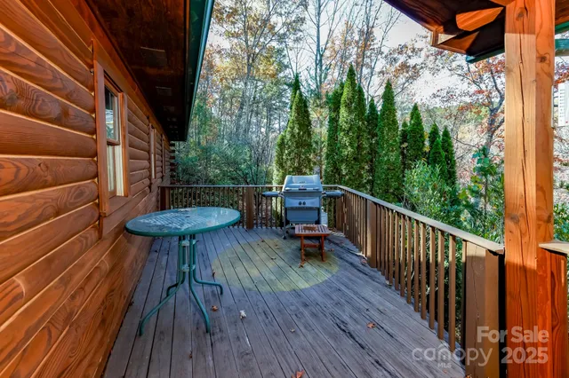 a view of balcony with wooden floor and outdoor seating