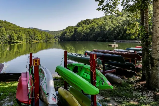 a view of a wooden deck and lake view