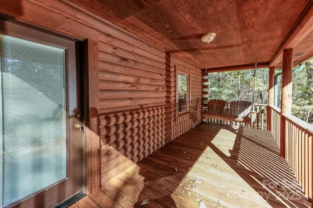 a view of balcony with wooden floor