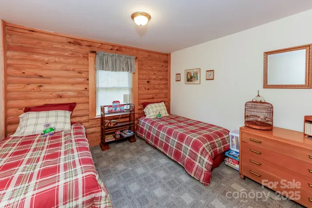 a bedroom with a bed and dresser