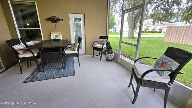 a view of a backyard with swimming pool