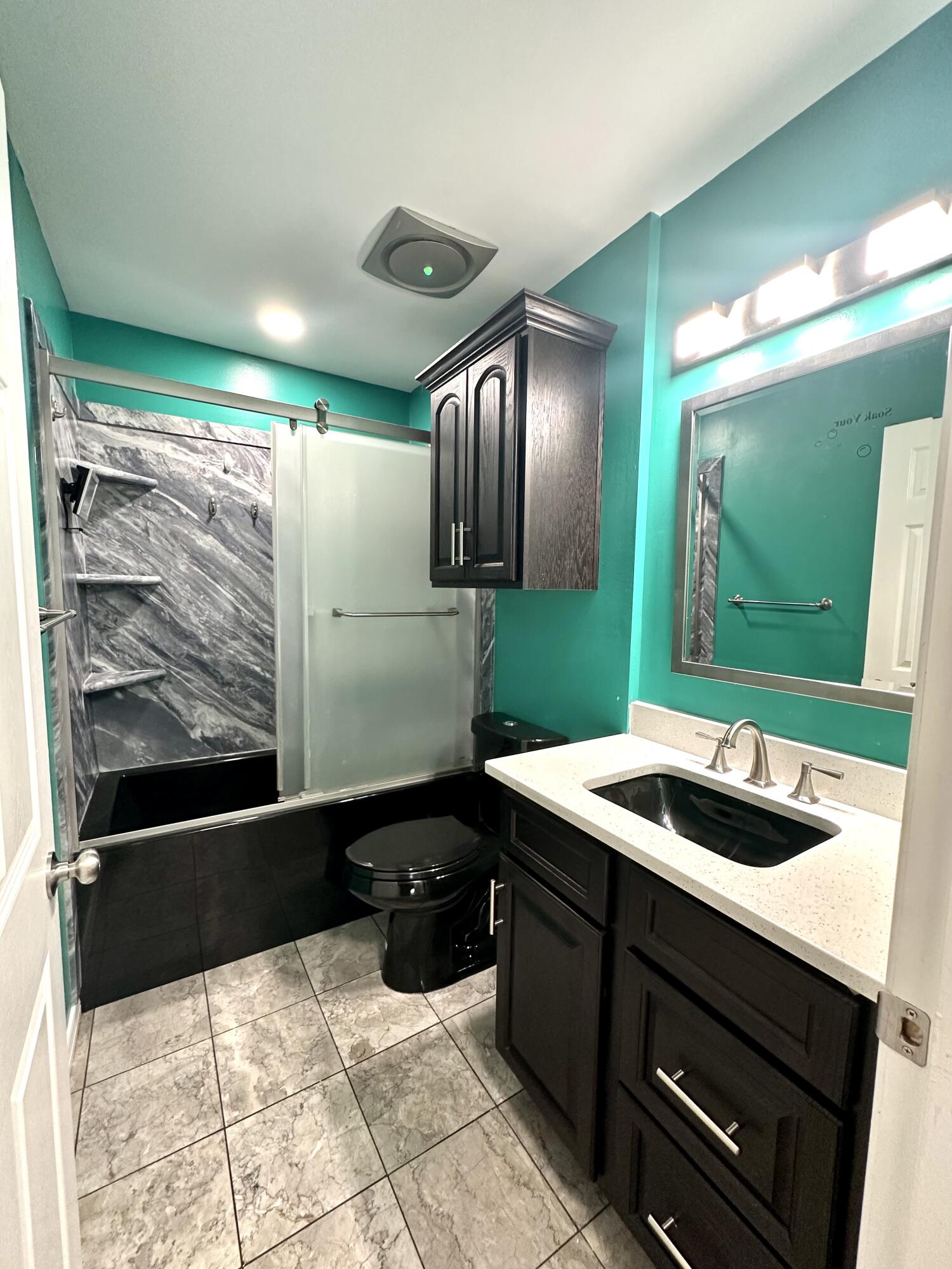 1765 Old Ranch Road Fort Walton Beach, FL 32547 - Photo 20 of 31 a kitchen with a sink and a refrigerator