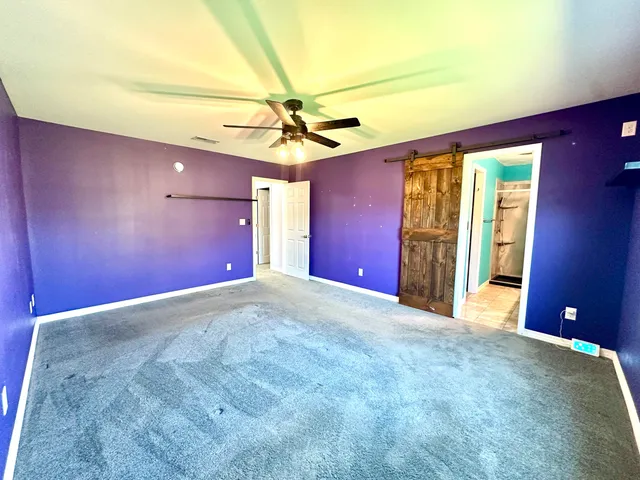 a bathroom with a tub and shower