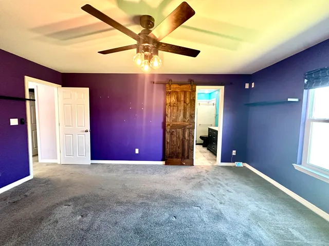 a bathroom with a granite countertop sink a shower and a mirror