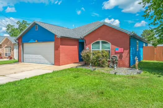 1765 Old Ranch Road Fort Walton Beach, FL 32547 - Photo 27 of 31 a front view of a house with a yard and garage