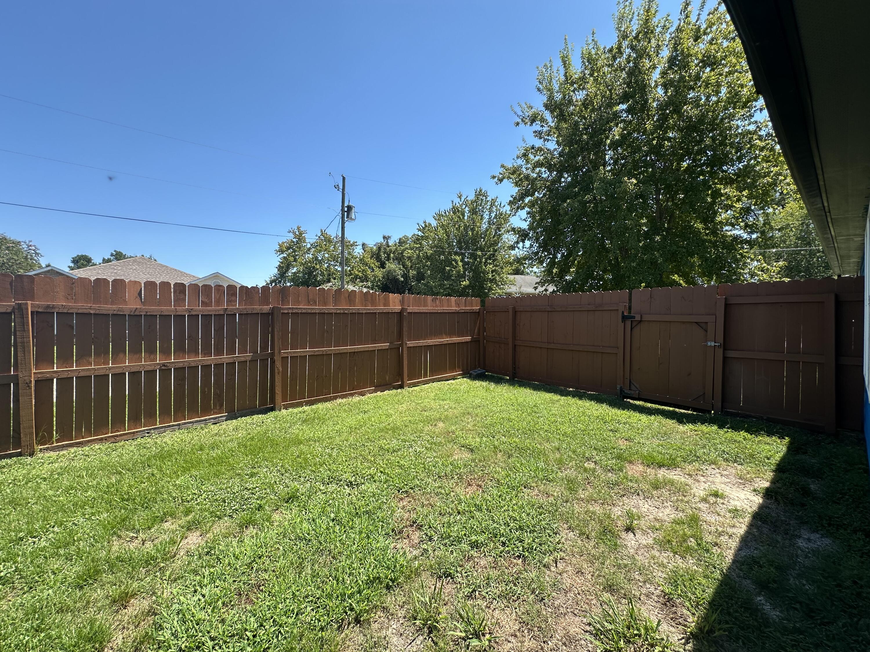 1765 Old Ranch Road Fort Walton Beach, FL 32547 - Photo 29 of 31 a view of a backyard with wooden fence