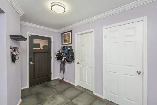 a view of a big room with windows and brick cabinets