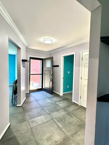 a front view of house with yard and trees