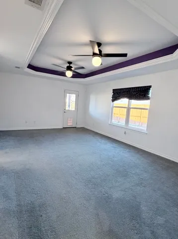 a view of a backyard with wooden fence